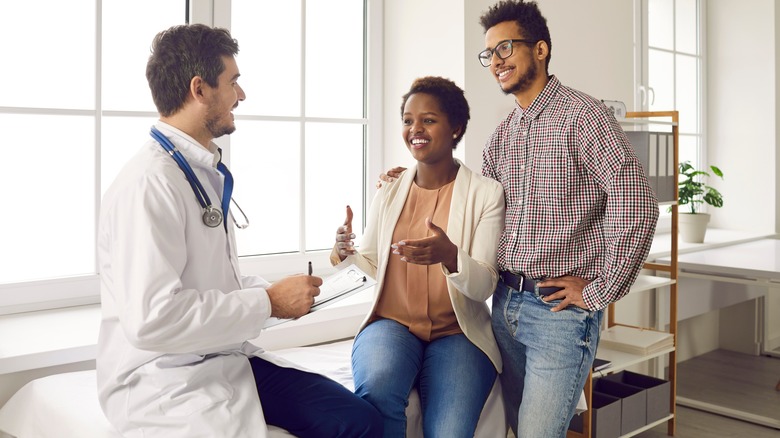 couple talking to doctor