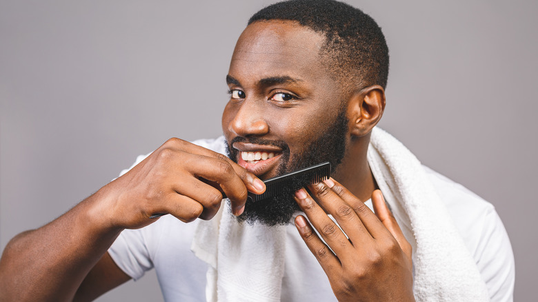a man combing his beard