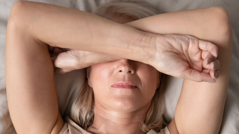 Woman lying in bed