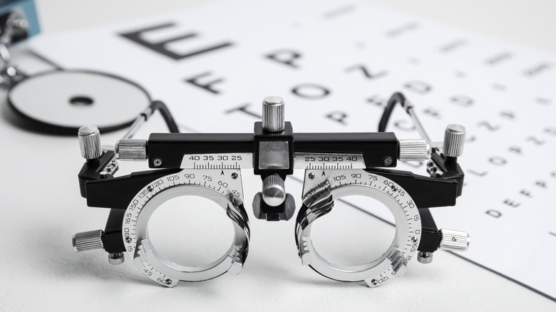 Ophthalmologist equipment by an eye chart