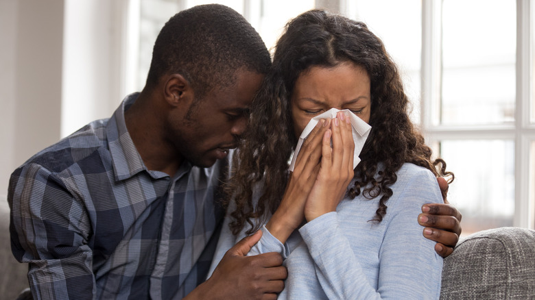 Woman and man crying 