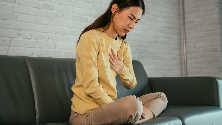 Woman having breast pain before her period