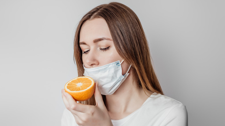 Woman smell training with orange