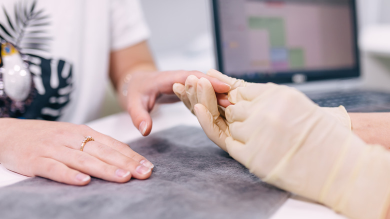 Woman getting her finger checked