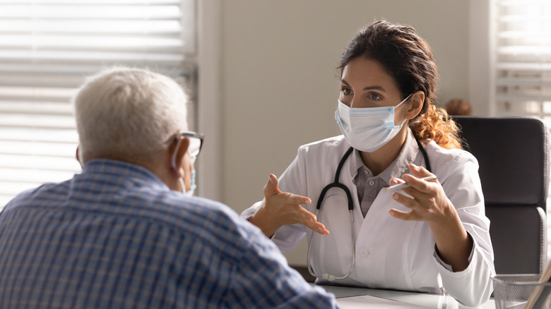 Doctor speaking with patient