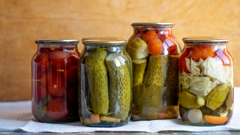 Severals jars of pickles on a table