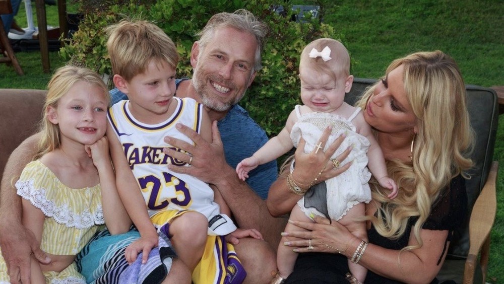 Jessica Simpson with her family, all smiling and baby crying