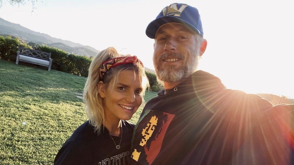 Jessica Simpson smiling with her husband Eric Johnson