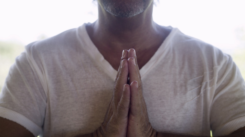 person sitting in meditation