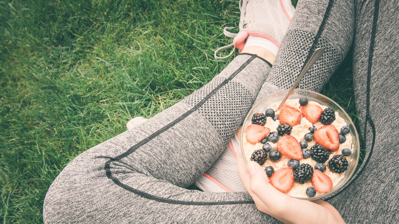 Female runner eating oatmeal