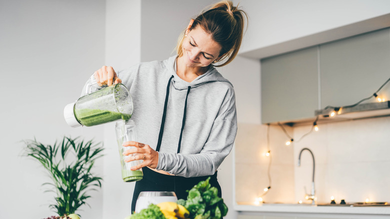 Woman making healthy shake 