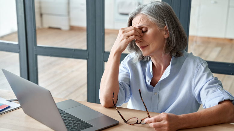 Woman working and feeling dizzy 