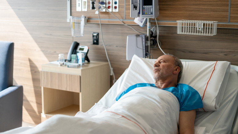 man in hospital bed