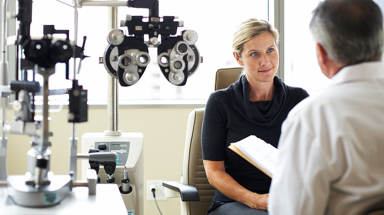 woman being examined by eye doctor