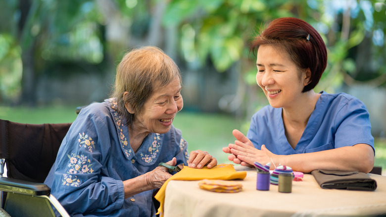 A woman talks to her mother with Alzheimer's