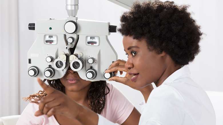 Eye doctor giving eye exam