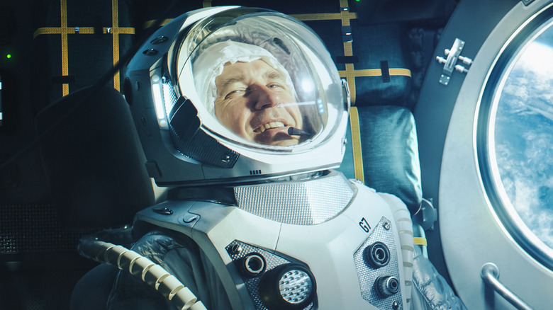 man smiling in space