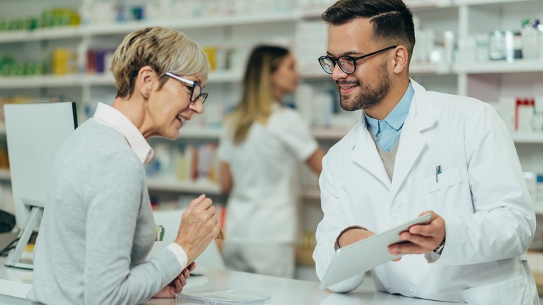 woman talking to pharmacist