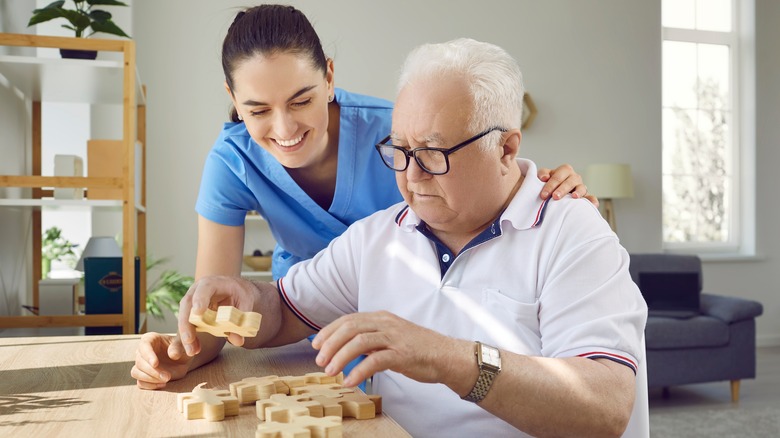 Elderly person with head puzzle