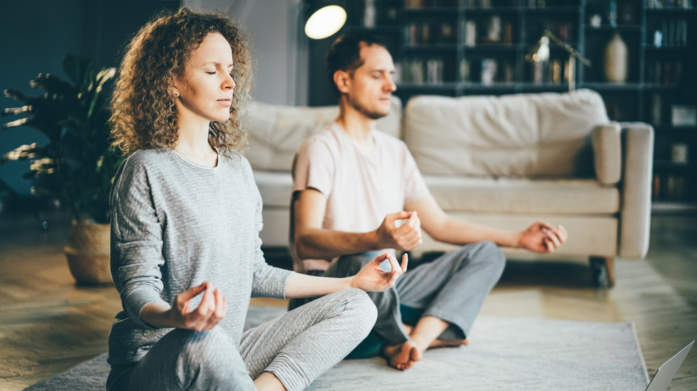 Couple meditating during yoga