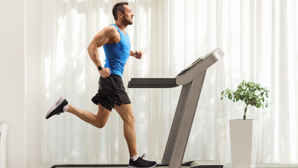 man running on treadmill