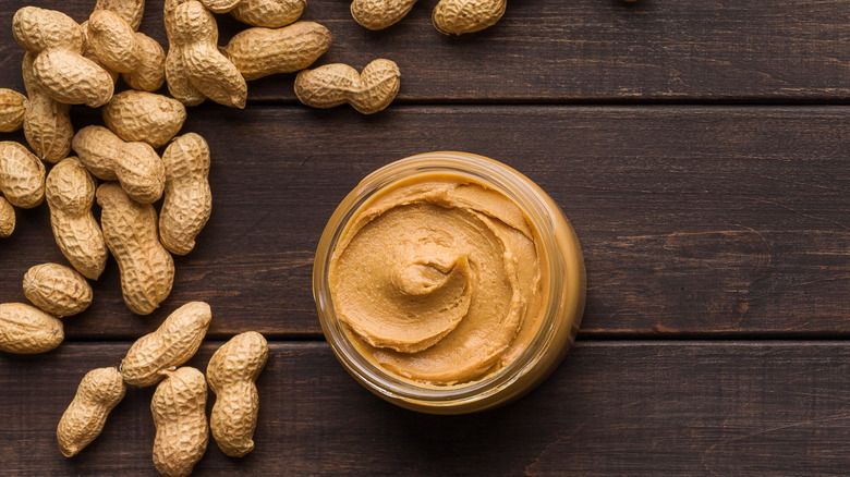 peanut butter and peanuts on table