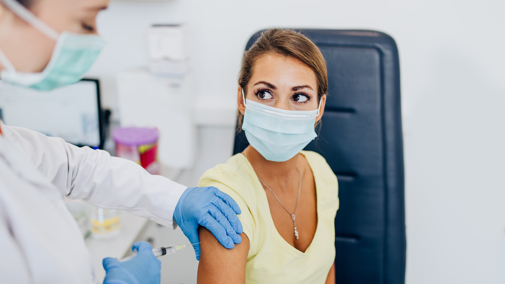 woman getting vaccinated