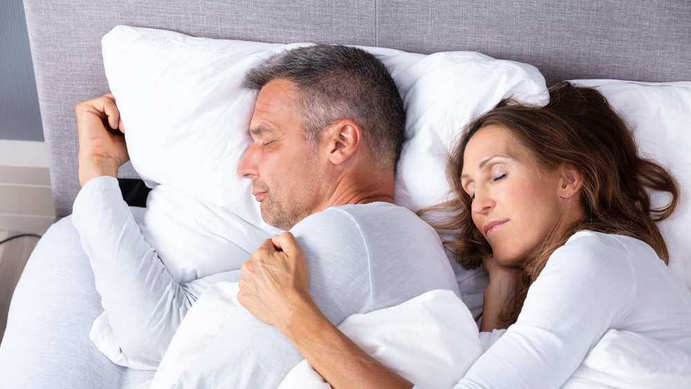 Couple napping in bed