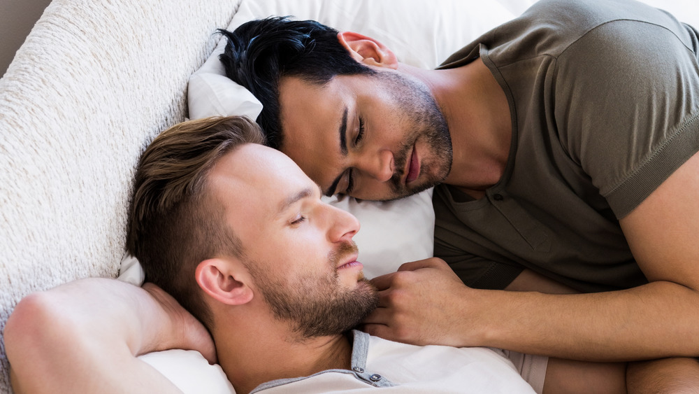 Couple napping in bed