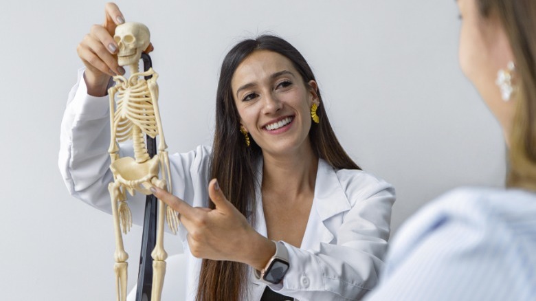 professor with skeletal model