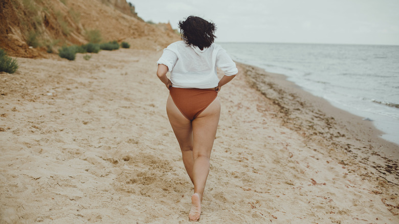 woman walks on the beach