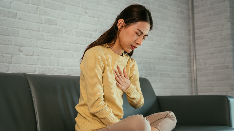 A woman suffers from heartburn