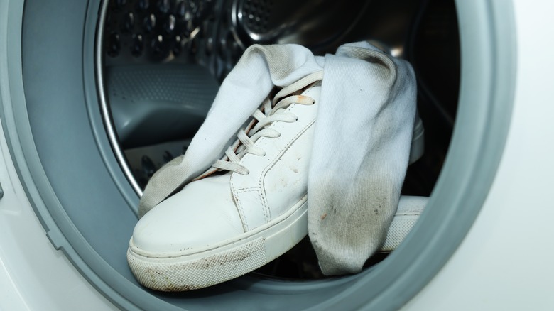 Dirty socks and sneakers in washing machine