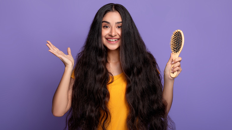 a teenager brushing her hair