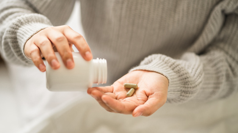 woman taking supplements