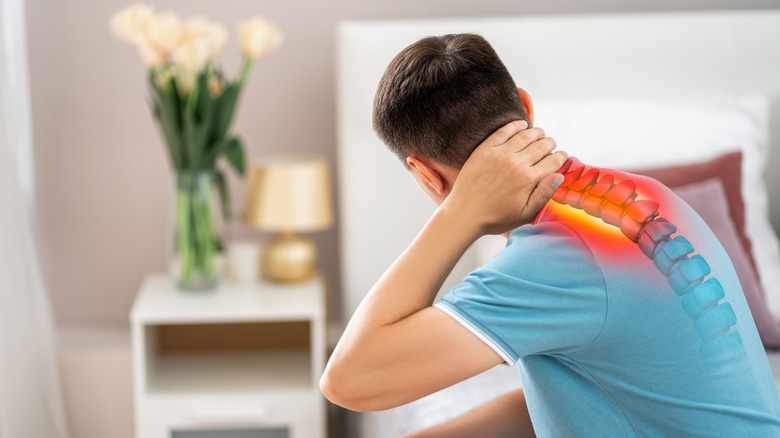 graphic of man's inflamed back with red spine