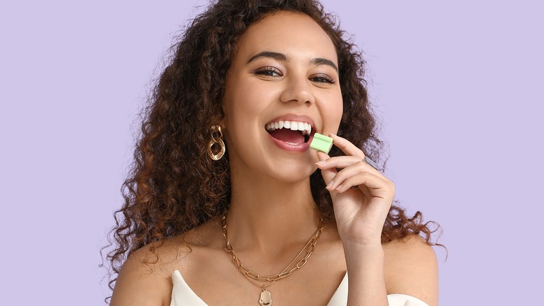 Woman holding gum