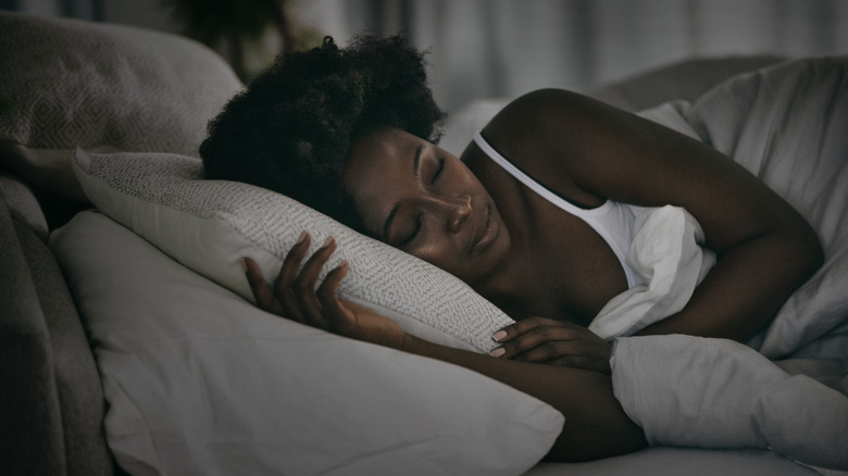 A woman sleeping in bed