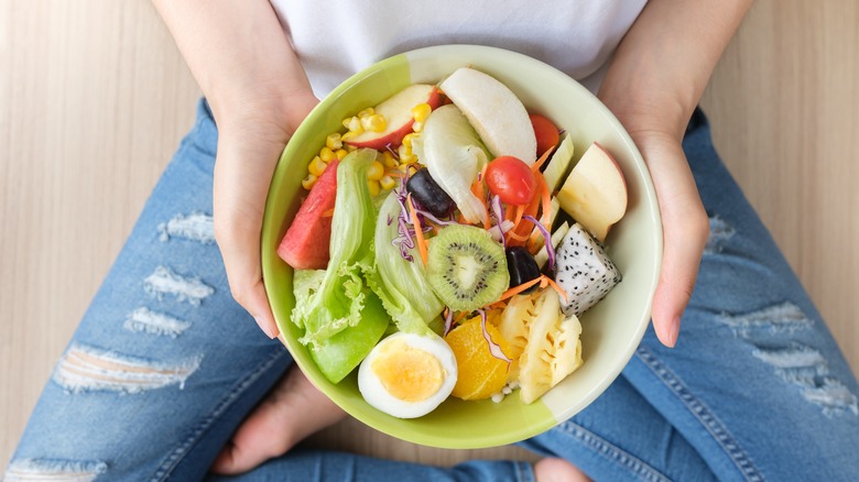 woman with halthy salad bowl