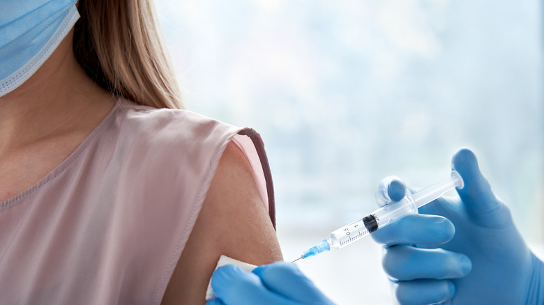 Woman getting vaccinated