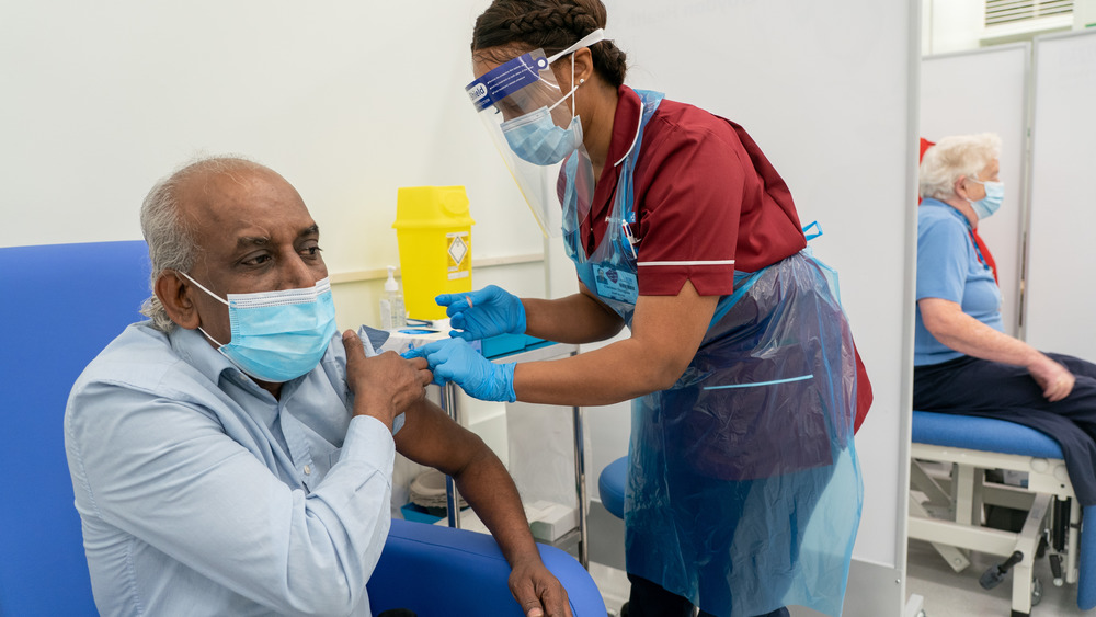 A man receives the vaccine in Wales