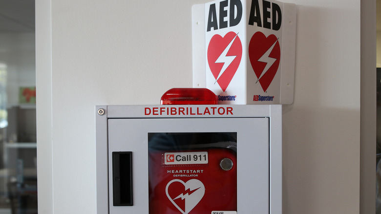 Defibrillator with an AED sign above