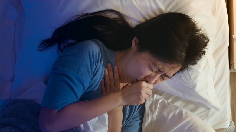 asian woman coughing at night