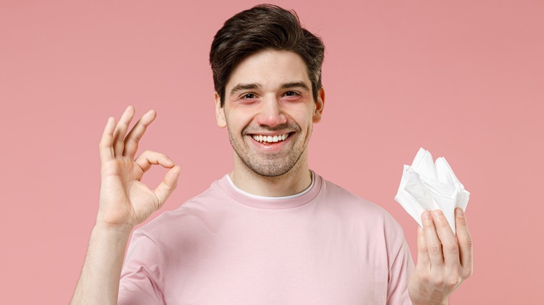 Man happy after he sneezes