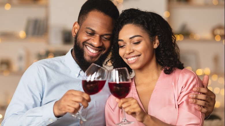 African American couple drinking wine