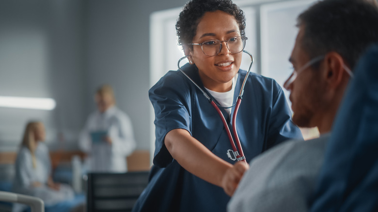 Doctor examining patient after surgery