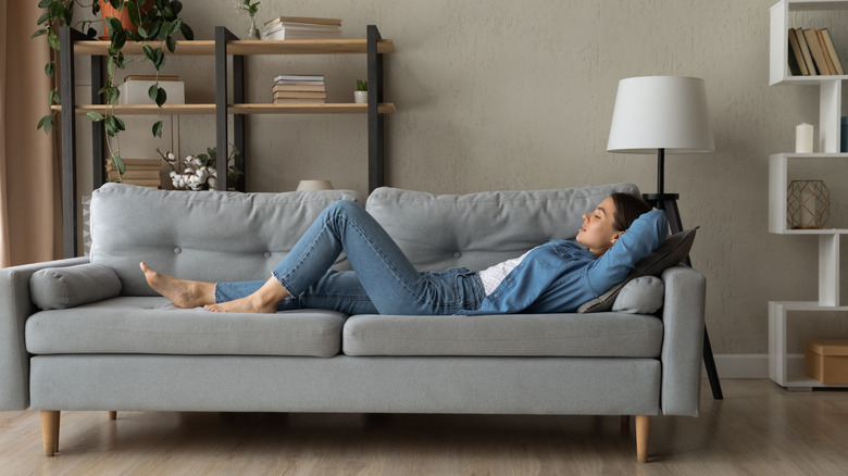 Woman resting on couch