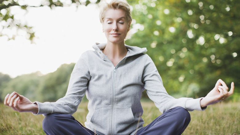 Woman meditating outside