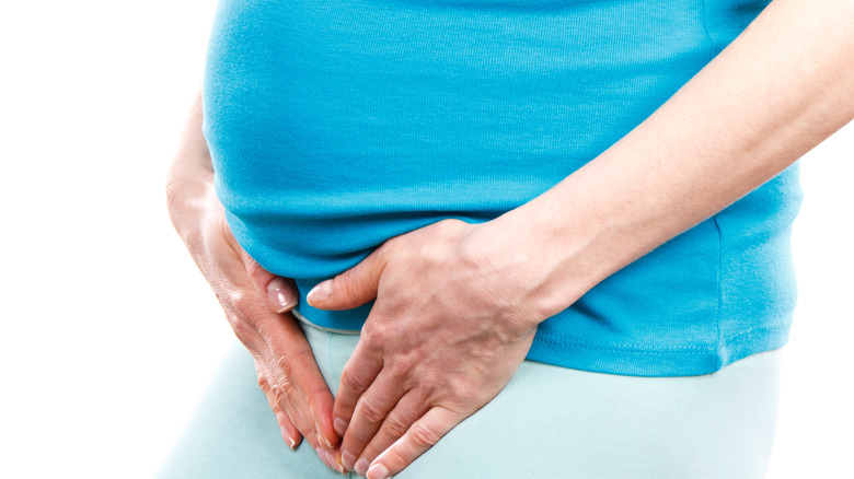 pregnant holding bladder