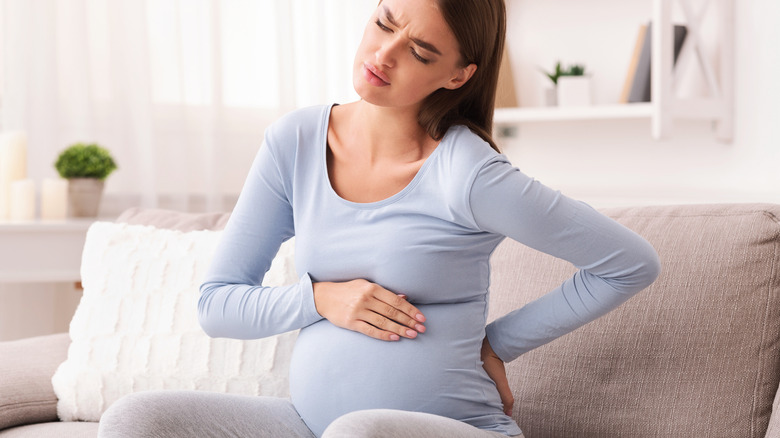pregnant woman experiencing backache